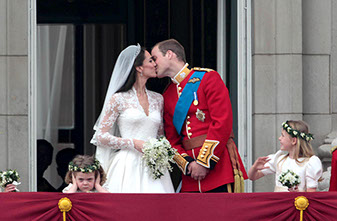 Prince William and Kate Middleton kiss on the balcony of Buckingham Palace after their wedding at Westminster Abbey
